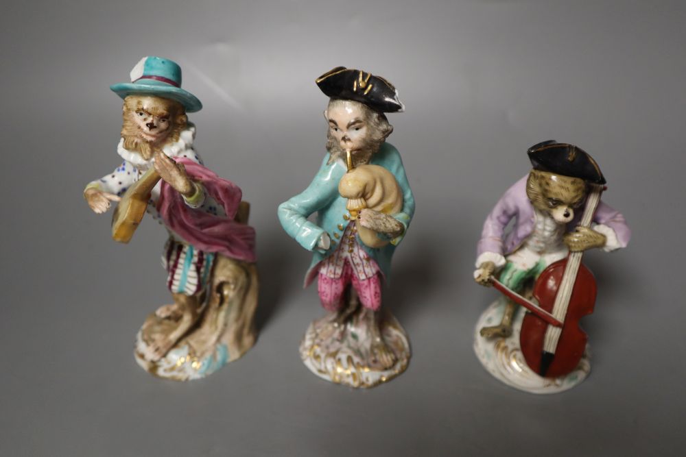 Six 19th century Meissen monkey band figures and another Volkstedt example, tallest 15cm